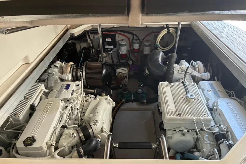 Slide: The Image of Engine compartment of a 2013 Sea Ray 470 Sundancer yacht, showcasing twin engines. - 19