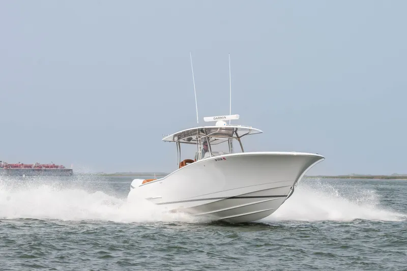 Slide: The Image of 2022 Mag Bay 33cc boat cruising on open water. - 3