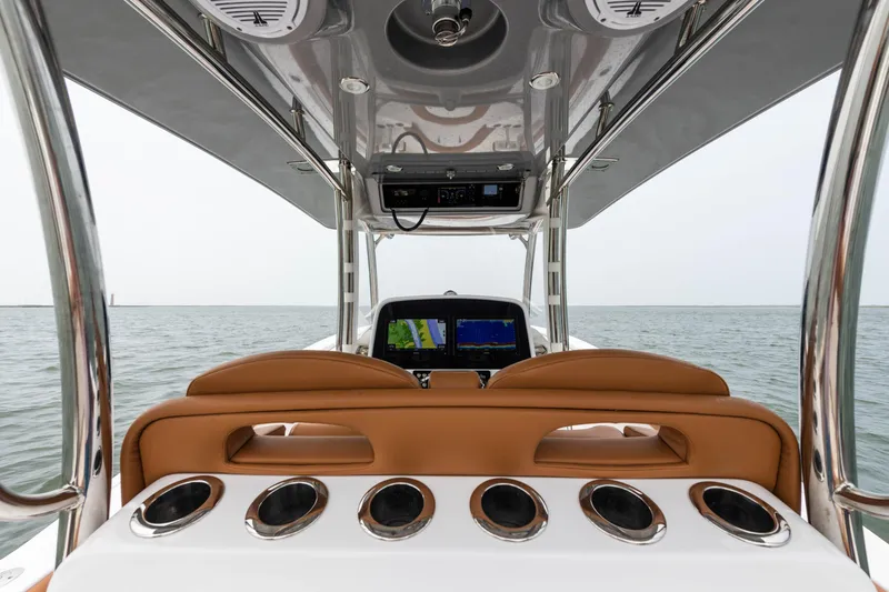 Slide: The Image of 2022 Mag Bay 33cc boat helm with navigation system and rod holders. - 7