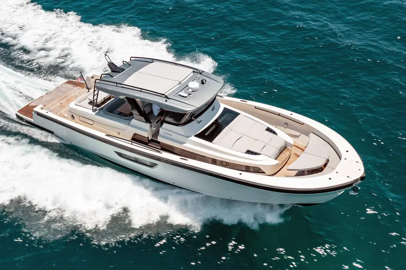 The Image of 2019 Bluegame BG62 luxury yacht cruising on the ocean. - 0