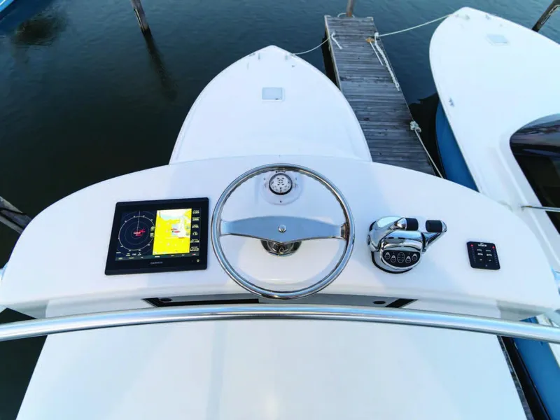 Slide: The Image of 2025 Viking 38 Open Billfish boat helm with navigation system and controls. - 10