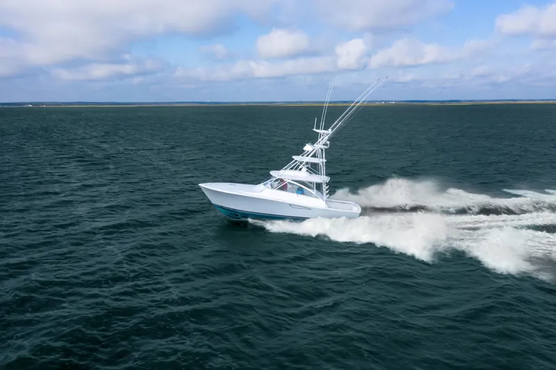 Slide: The Image of 2025 Viking 38 Open Billfish cruising on open water. - 12