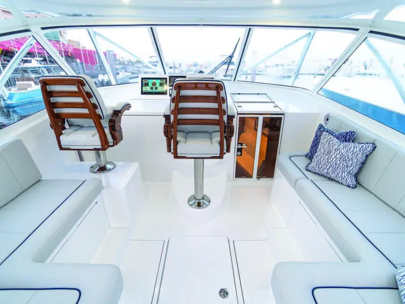 Slide: The Image of 2025 Viking 38 Open Billfish cockpit with helm chairs and seating. - 6