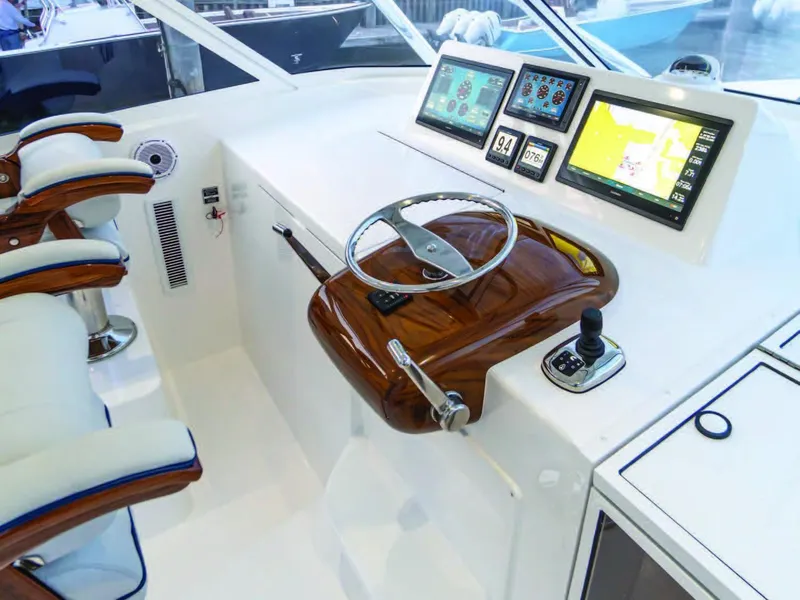 Slide: The Image of 2025 Viking 38 Open Billfish helm with advanced navigation displays and luxurious seating. - 7