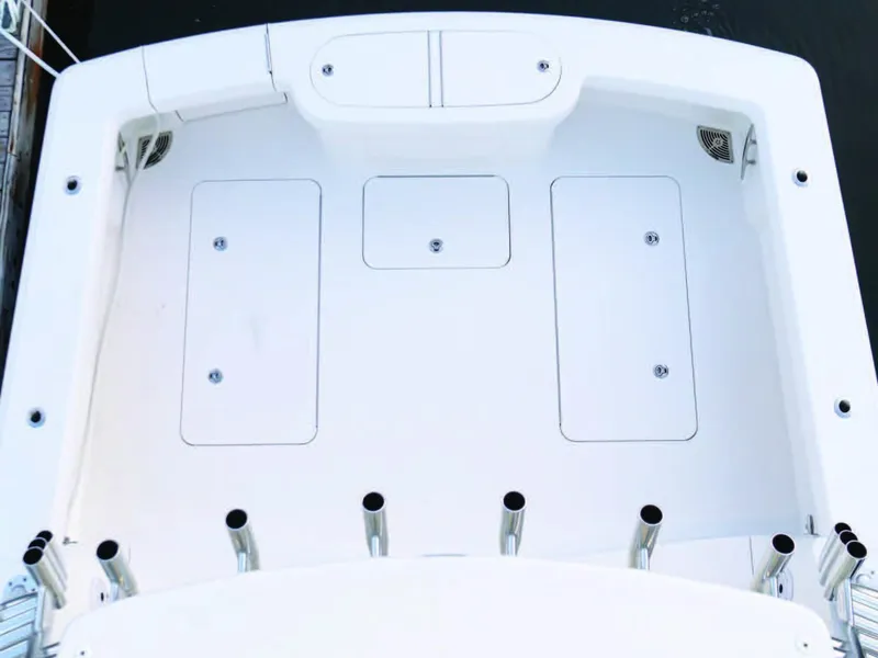 Slide: The Image of 2025 Viking 38 Open Billfish boat deck with storage compartments and rod holders. - 9