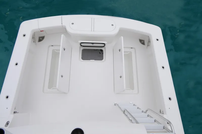 Slide: The Image of 2025 Viking 38 Billfish boat deck with storage compartments and ladder. - 14