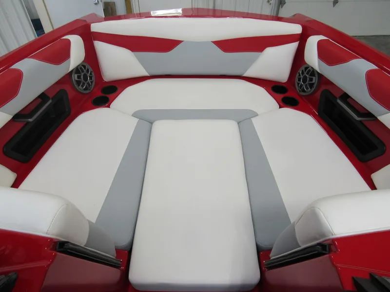 Slide: The Image of 2022 Axis A22 boat interior with red, white, and gray seating. - 10