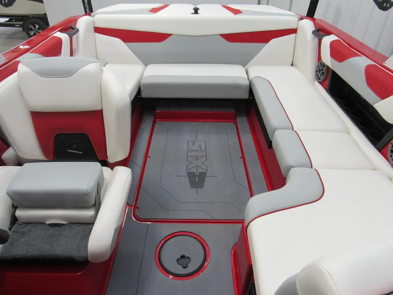 Slide: The Image of 2022 Axis A22 boat interior with red, white, and gray seating and flooring. - 11