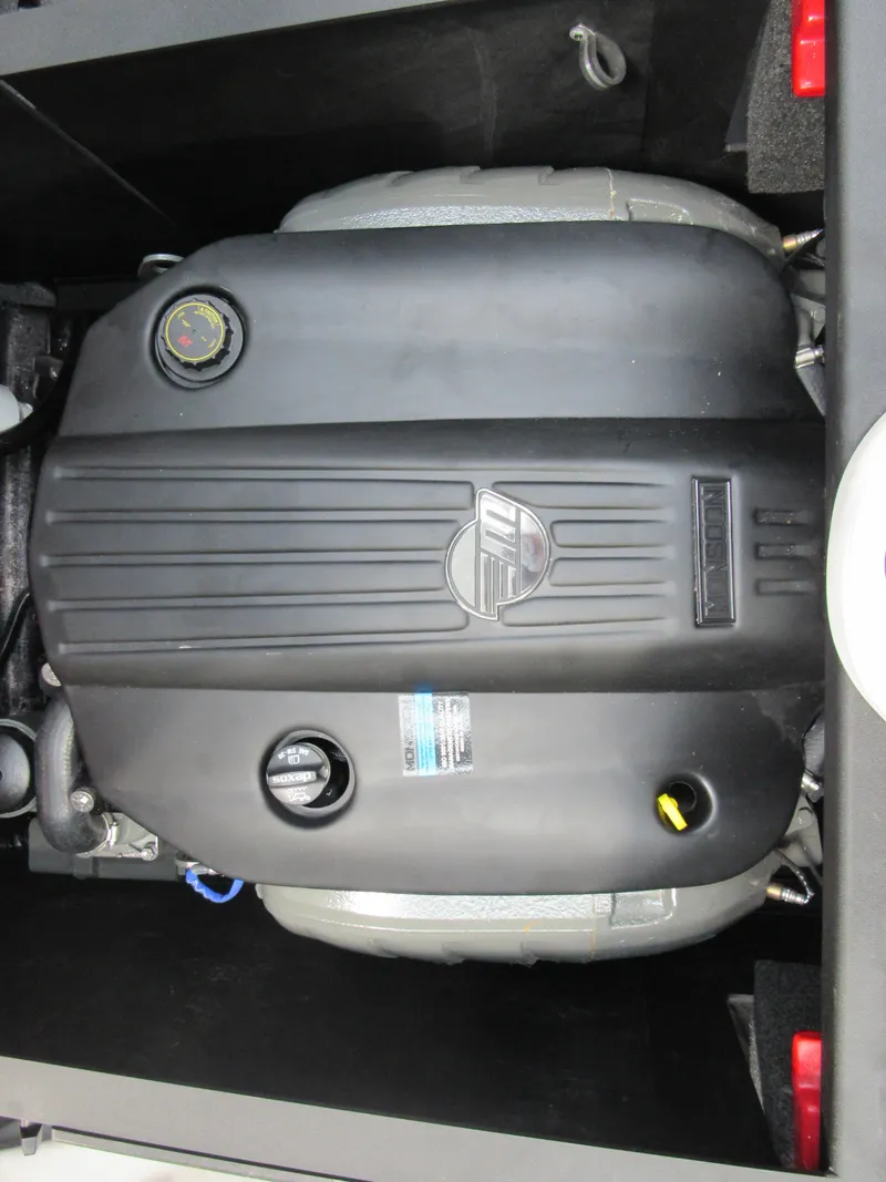 Slide: The Image of 2022 Axis A22 boat engine compartment with a covered engine. - 14
