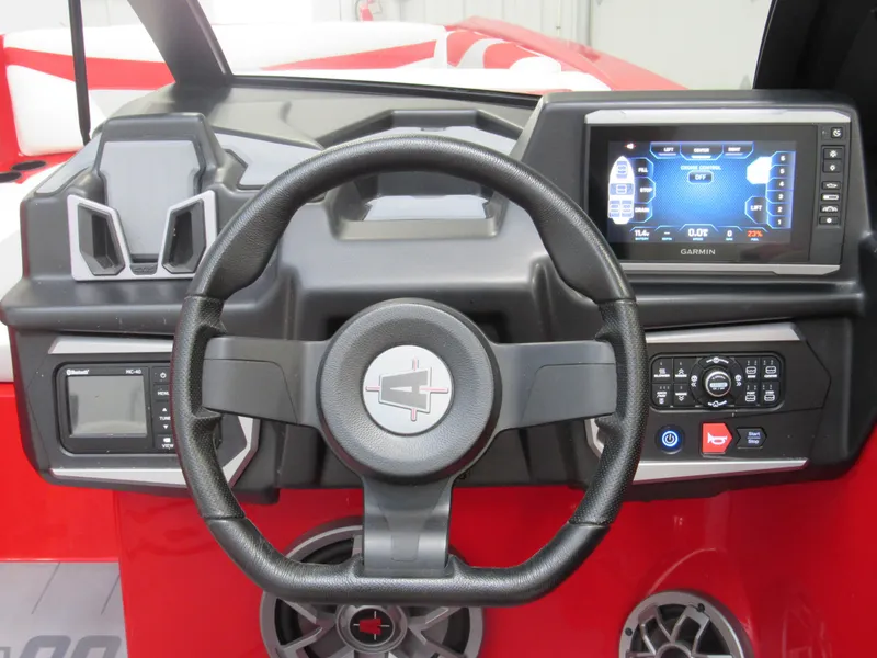 Slide: The Image of 2022 Axis A22 boat dashboard with steering wheel and touchscreen display. - 8