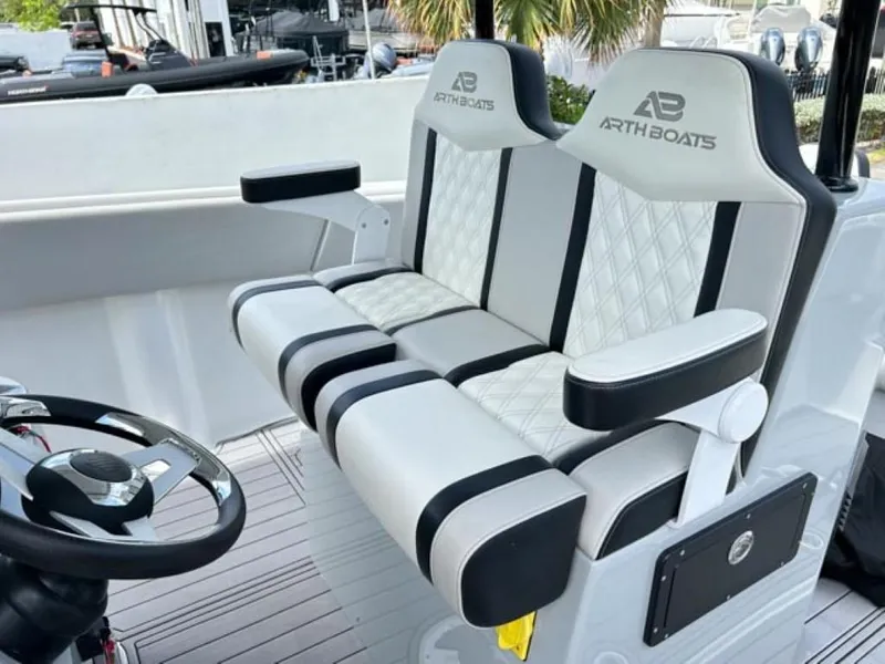 Slide: The Image of 2023 AMP Arth 333 boat seats with diamond-stitched upholstery and armrests. - 10