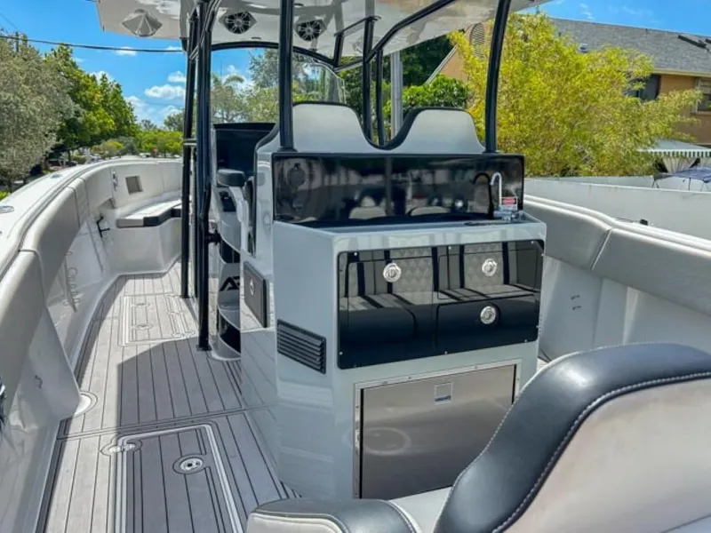 Slide: The Image of 2023 AMP Arth 333 boat interior with modern seating and control panel. - 12