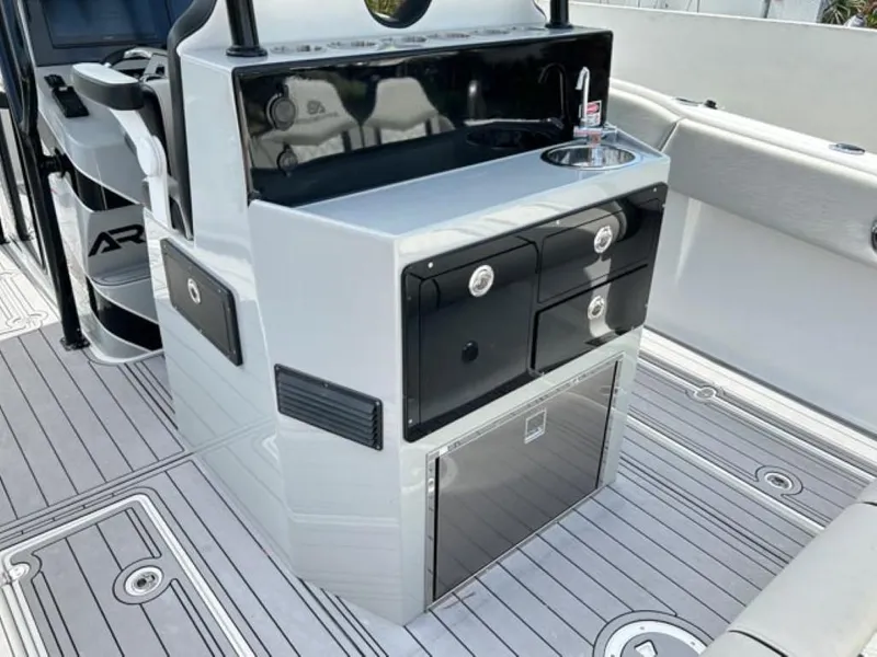 Slide: The Image of Modern AMP Arth 333 boat interior with sink, storage drawers, and sleek design, 2023 model. - 15