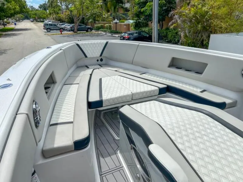 Slide: The Image of 2023 AMP Arth 333 boat interior with cushioned seating and modern design. - 5