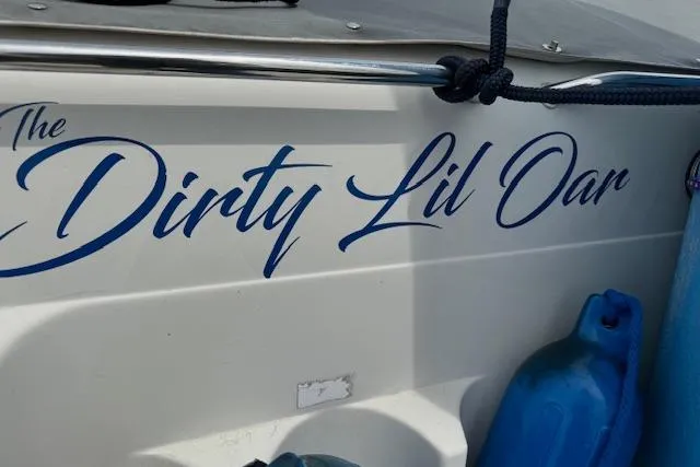 Slide: The Image of 1995 Regal 256 Commodore boat with The Dirty Lil Oar name decal. - 10