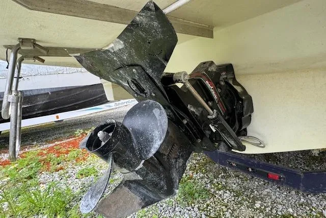 Slide: The Image of 1995 Regal 256 Commodore boat propeller and stern drive on trailer. - 12