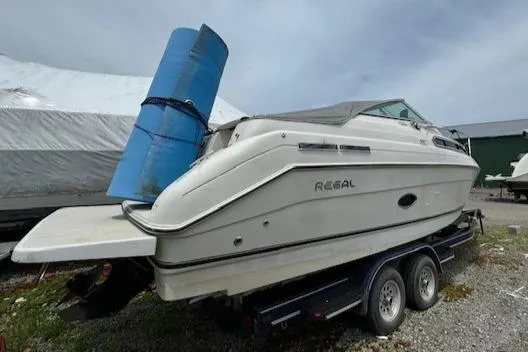 Slide: The Image of 1995 Regal 256 Commodore boat on trailer, side view. - 13