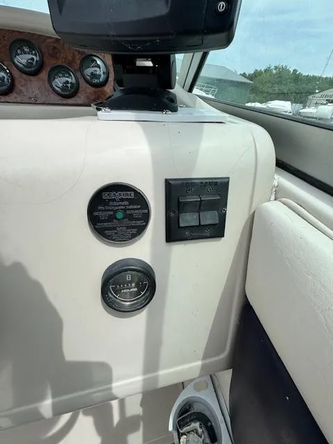 Slide: The Image of 1995 Regal 256 Commodore boat dashboard with gauges and controls. - 17