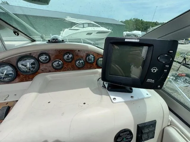 Slide: The Image of 1995 Regal 256 Commodore boat dashboard with Humminbird 571 HD fishfinder. - 18