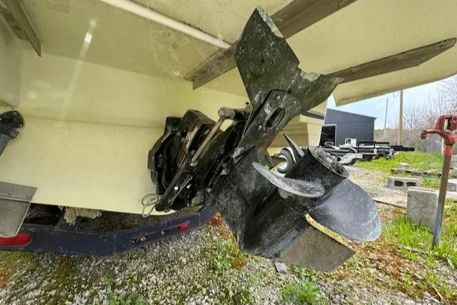 Slide: The Image of Damaged propeller of a 1995 Regal 256 Commodore boat on a trailer. - 6
