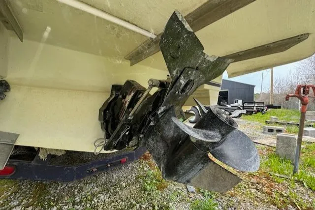 Slide: The Image of 1995 Regal 256 Commodore boat propeller and stern drive in a yard. - 7