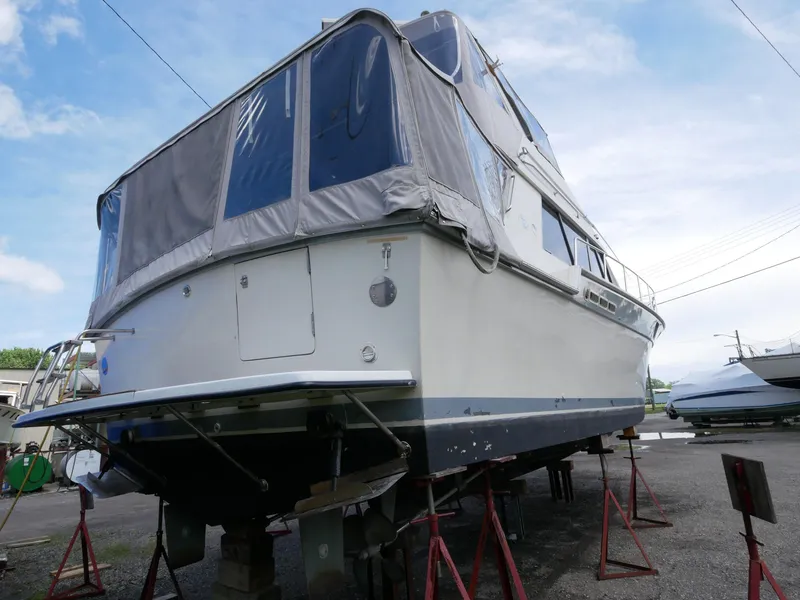 Slide: The Image of 1986 Silverton 40 Convertible boat on stands for maintenance. - 12