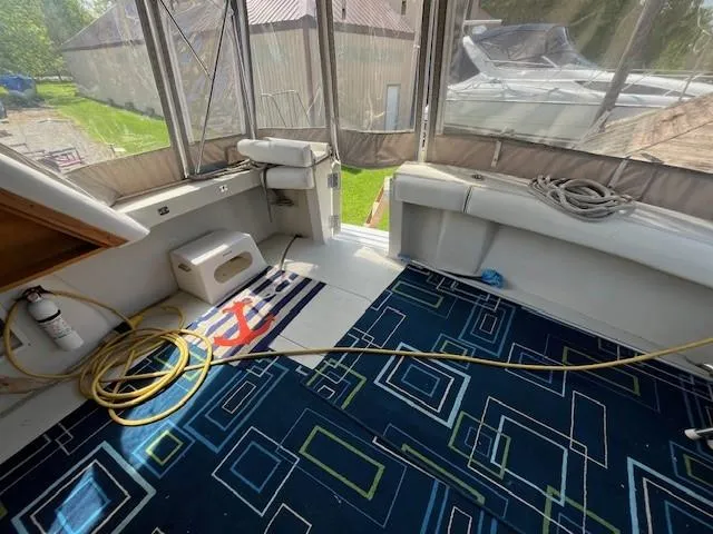 Slide: The Image of Interior view of 1986 Silverton 40 Convertible boat with geometric carpet and nautical decor. - 17