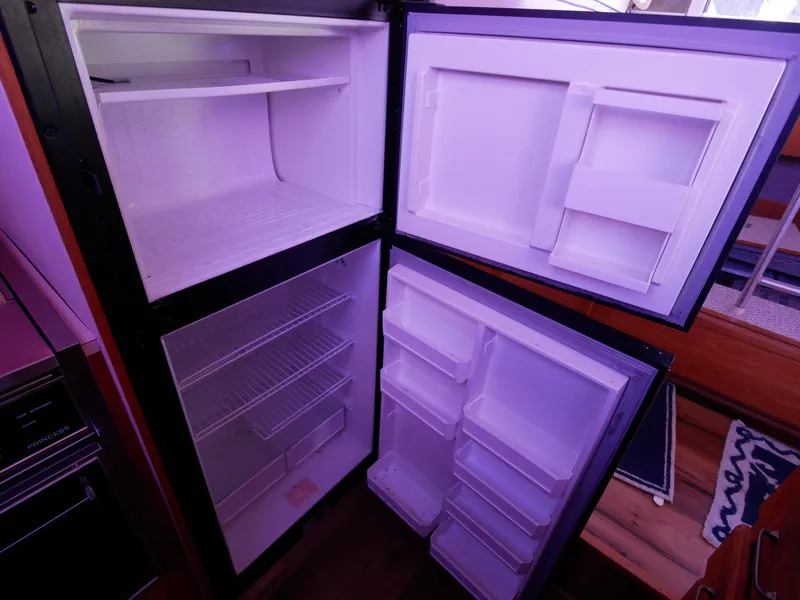 Slide: The Image of Open refrigerator inside a 1986 Silverton 40 Convertible boat. - 31