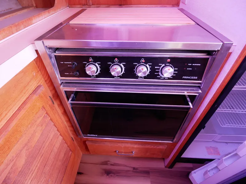 Slide: The Image of Stainless steel oven in the 1986 Silverton 40 Convertible yacht kitchen. - 32