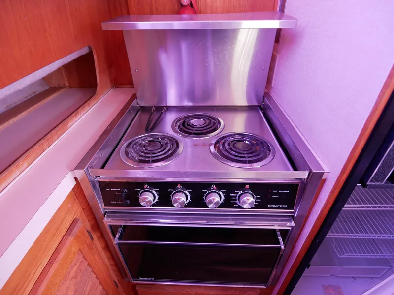 Slide: The Image of 1986 Silverton 40 Convertible boat kitchen with electric stove and oven. - 33