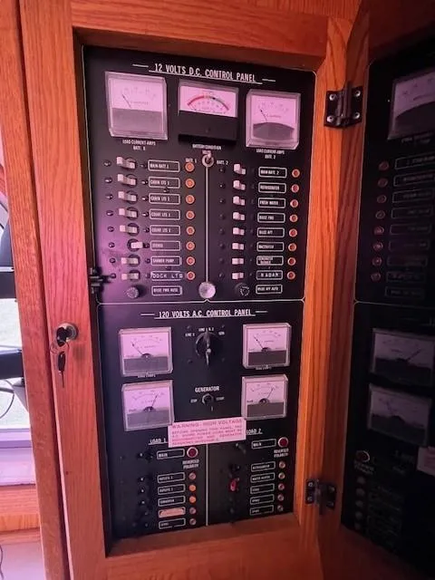Slide: The Image of Electrical control panel of a 1986 Silverton 40 Convertible boat. - 45