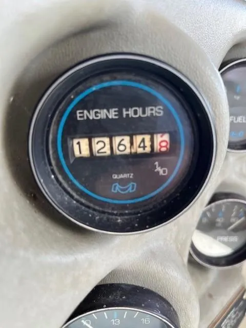 Slide: The Image of Engine hours gauge on a 1986 Silverton 40 Convertible boat showing 1264.8 hours. - 48