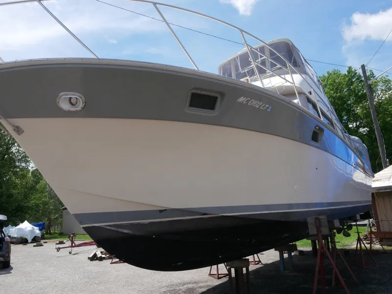 Slide: The Image of 1986 Silverton 40 Convertible boat on dry dock for maintenance. - 8