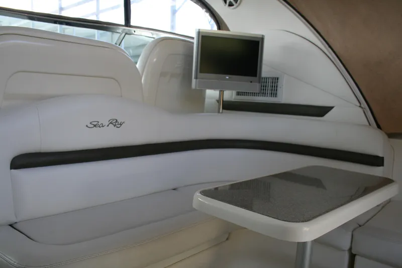 Slide: The Image of Interior of 2006 Sea Ray Sundancer 380 with white seating and mounted TV. - 15