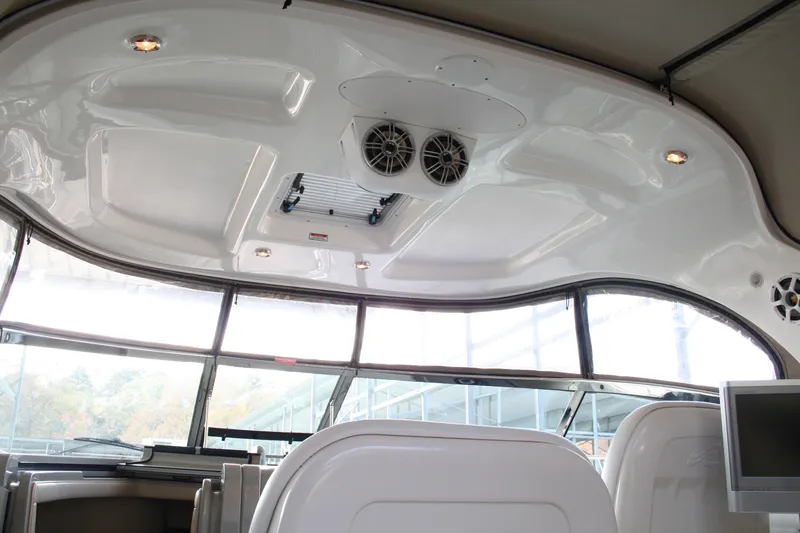 Slide: The Image of Interior view of 2006 Sea Ray Sundancer 380 boat with ceiling speakers and seating. - 16
