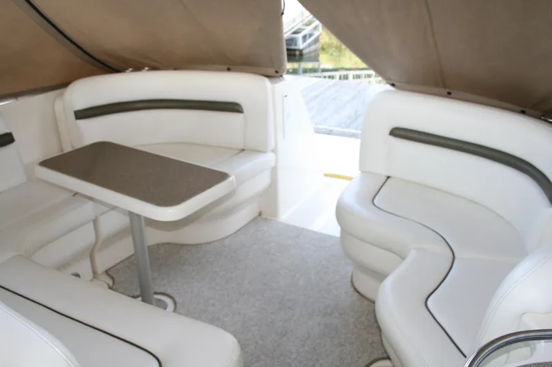 Slide: The Image of 2006 Sea Ray Sundancer 380 interior with white seating and table. - 18