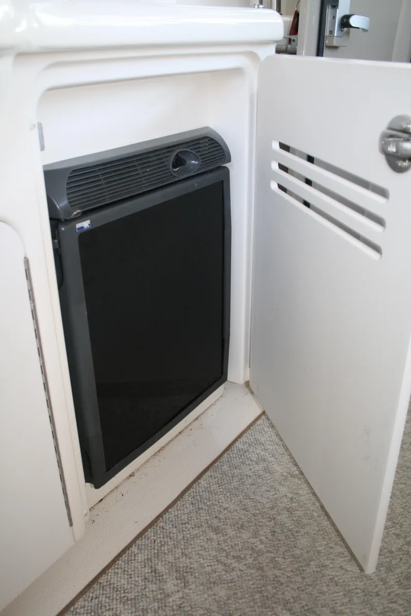 Slide: The Image of Compact refrigerator inside a 2006 Sea Ray Sundancer 380 yacht cabinet. - 23