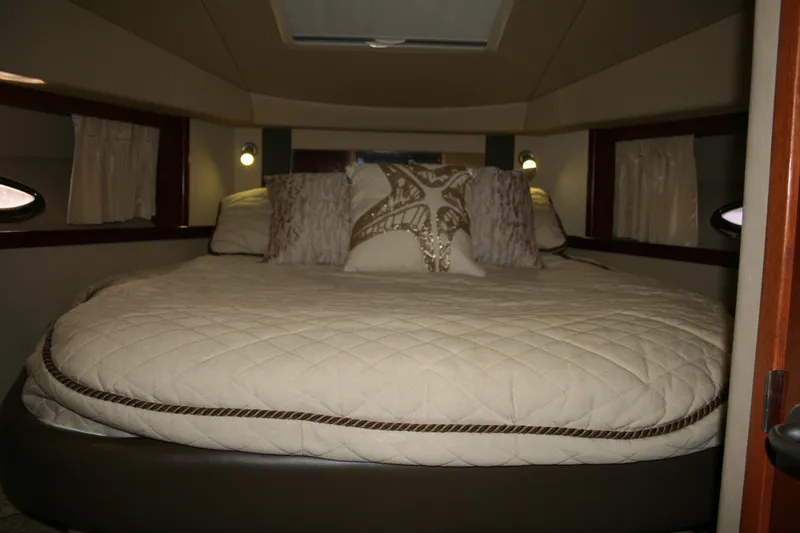 Slide: The Image of Luxurious cabin interior of 2006 Sea Ray Sundancer 380 yacht with plush bedding. - 25