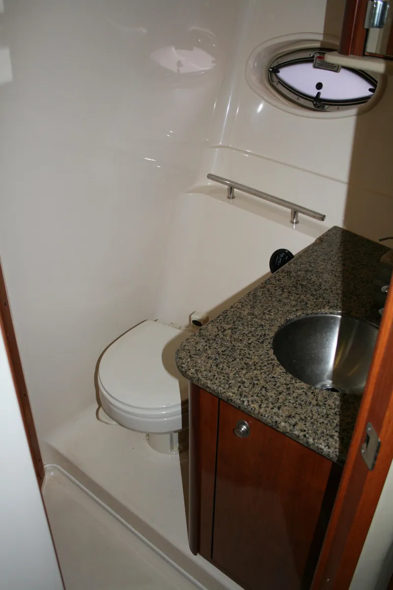 Slide: The Image of 2006 Sea Ray Sundancer 380 bathroom with granite countertop and stainless steel sink. - 26