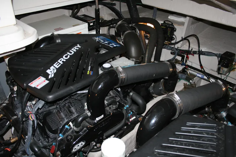 Slide: The Image of Engine compartment of 2006 Sea Ray Sundancer 380 with Mercury engine components. - 33
