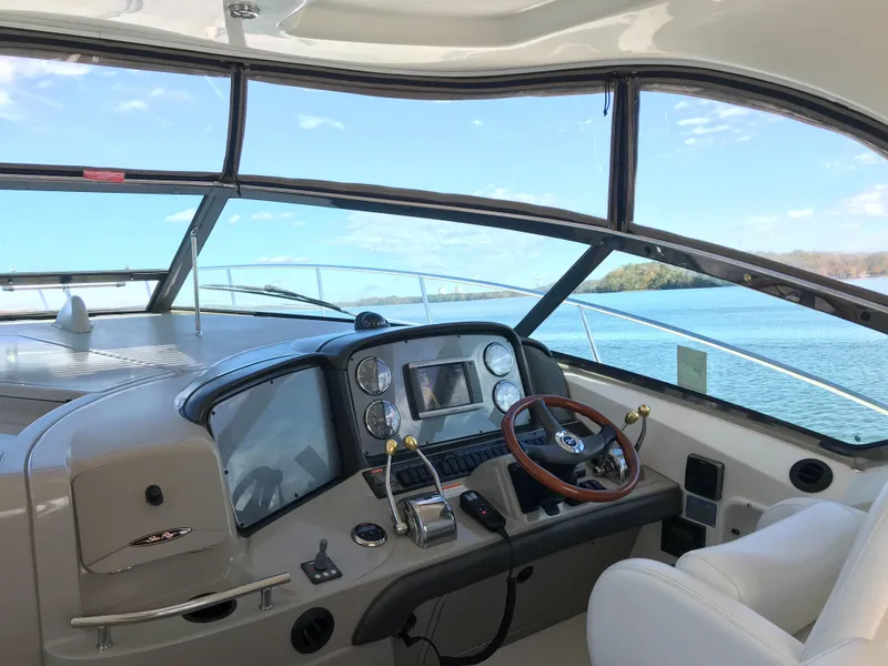 Slide: The Image of Helm of 2006 Sea Ray Sundancer 380 yacht with scenic water view. - 6