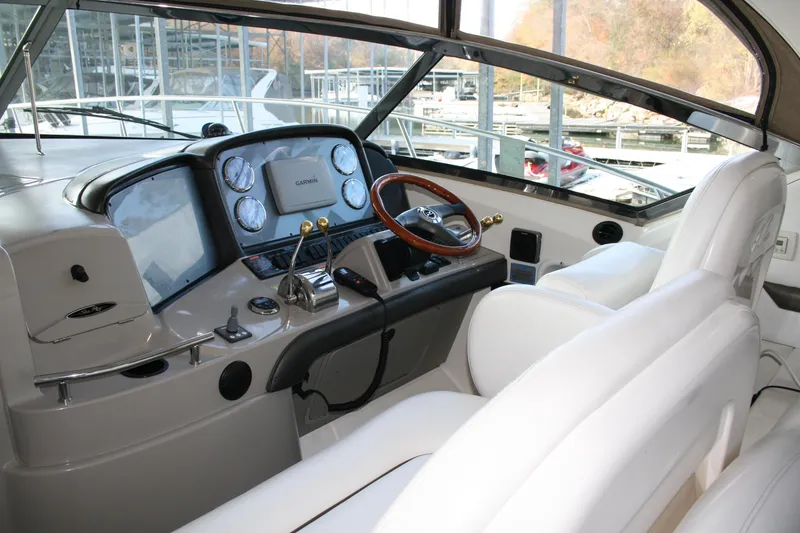 Slide: The Image of Helm of 2006 Sea Ray Sundancer 380 with modern controls and white seating. - 7