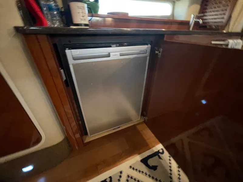 Slide: The Image of Built-in refrigerator in the galley of a 2014 Sea Ray 370 Sundancer yacht. - 11