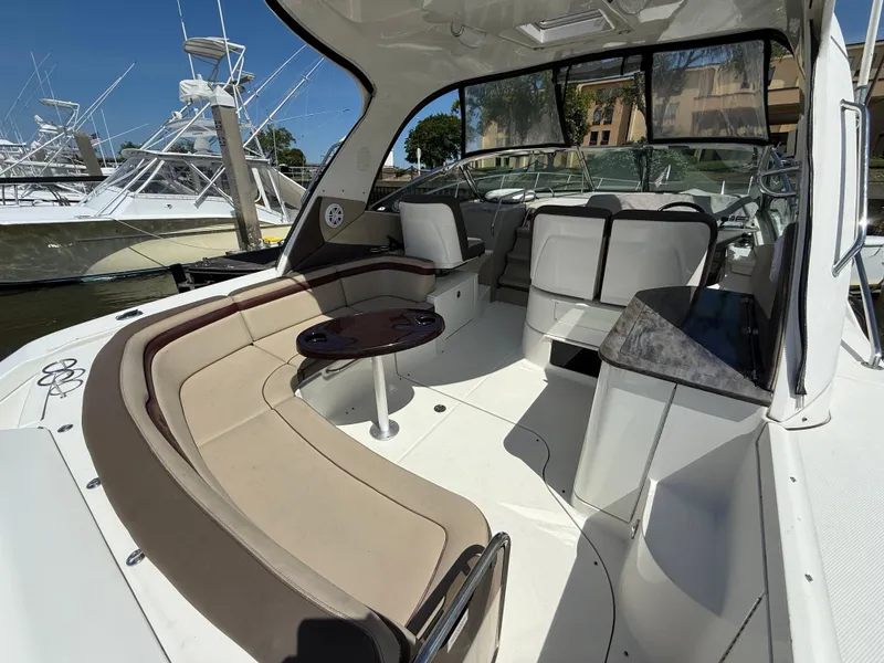 Slide: The Image of 2014 Sea Ray 370 Sundancer yacht interior with spacious seating and elegant design. - 16