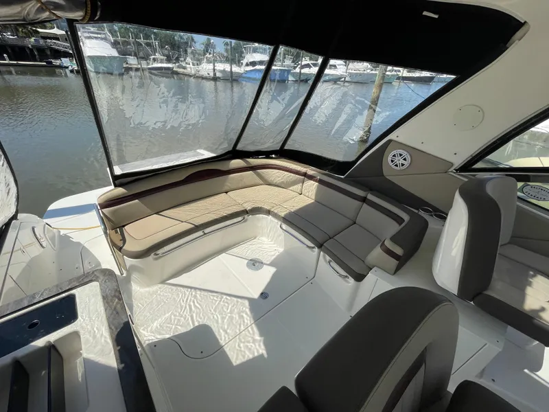 Slide: The Image of Interior seating area of 2014 Sea Ray 370 Sundancer yacht with marina view. - 23