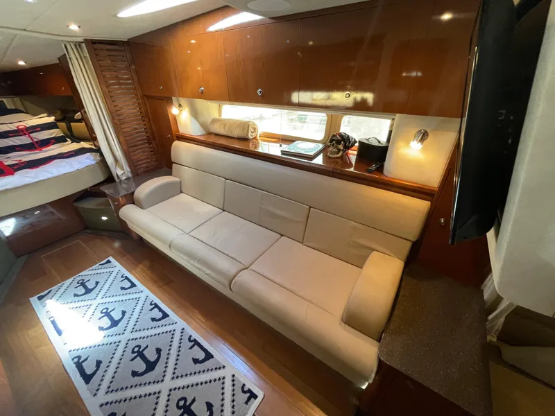 Slide: The Image of Interior of 2014 Sea Ray 370 Sundancer yacht with beige sofa and nautical decor. - 7