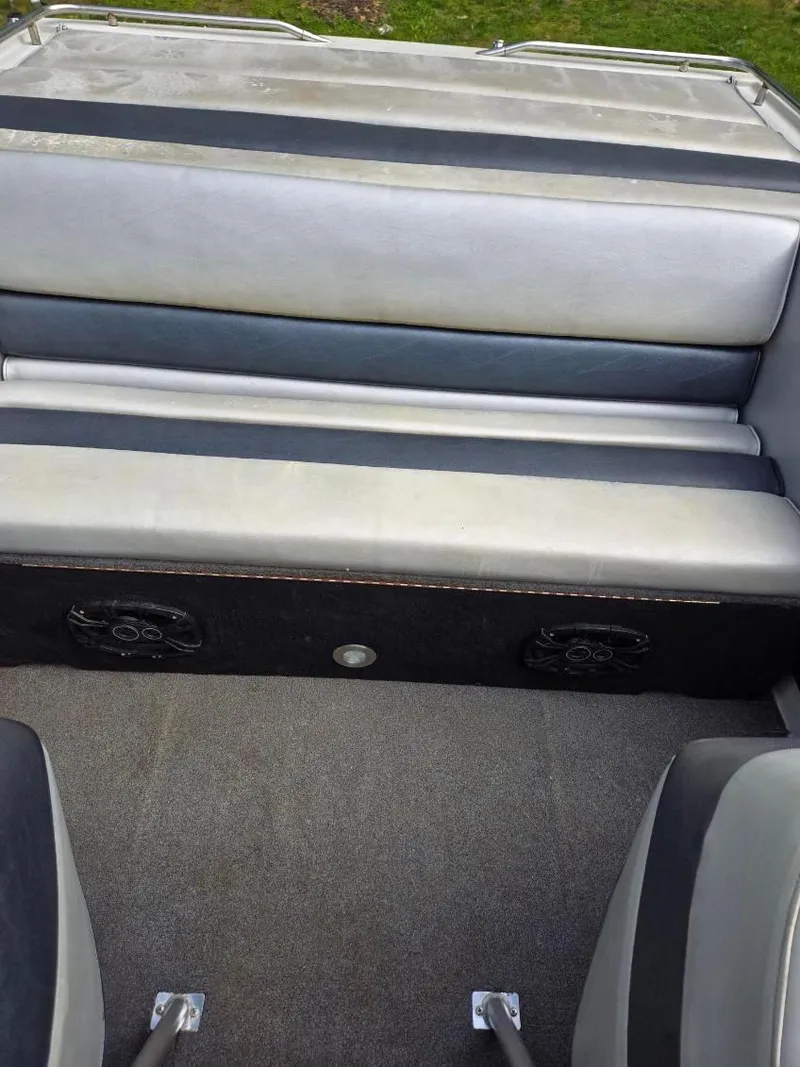 Slide: The Image of 1986 Formula 242 LS boat interior with gray seating and carpeted floor. - 14