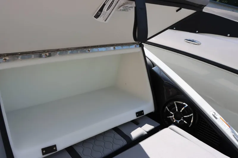 Slide: The Image of Open storage compartment on 2024 Yamaha Boats 255XE. - 22