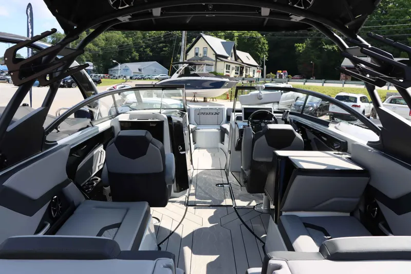 Slide: The Image of 2024 Yamaha Boats 255XE interior with modern seating and sleek design. - 23