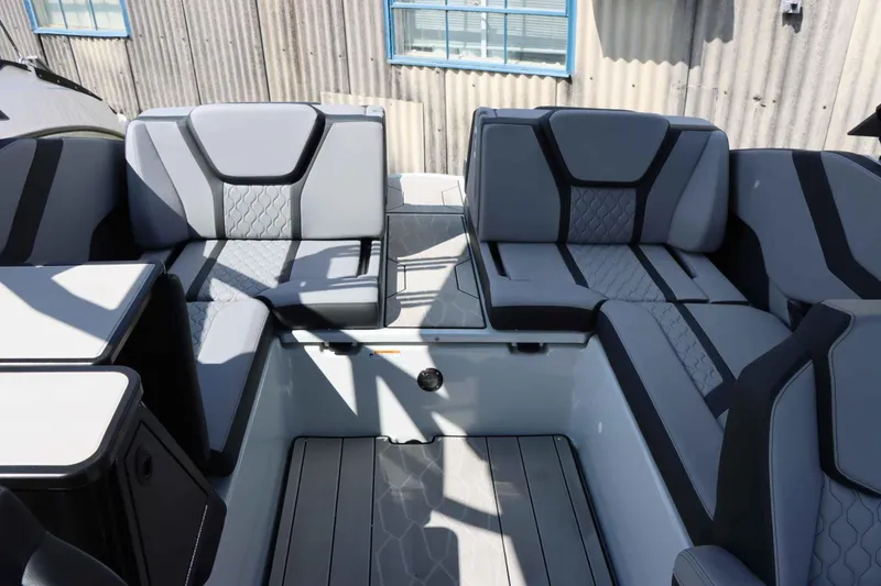 Slide: The Image of 2024 Yamaha Boats 255XE interior with modern gray seating and sleek design. - 26